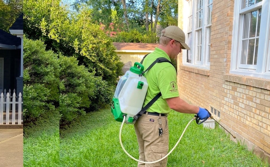 Pest'Em technician treating home exterior